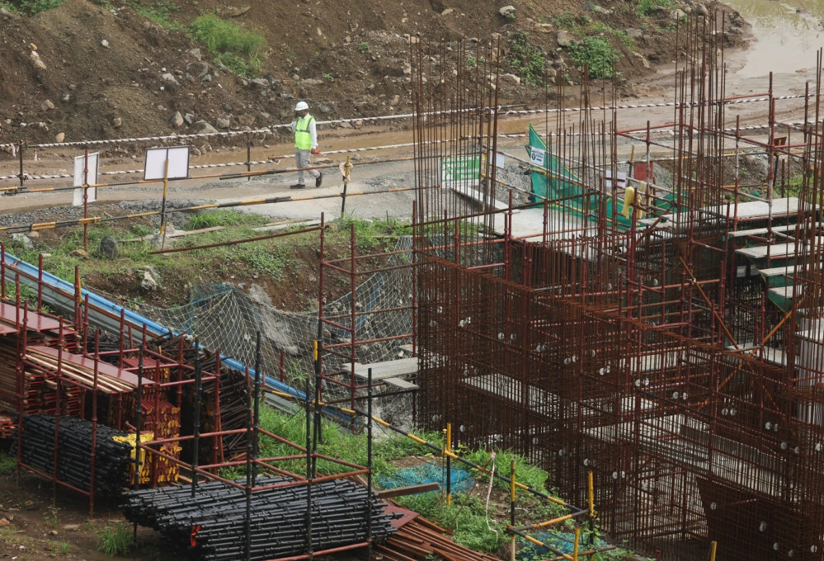 A worker walks at the construction site of an Amazon data center in Thane, India, September 22, 2026. (REUTERS)