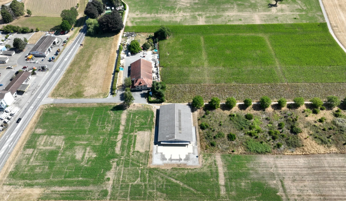 A drone view shows traces of a large basin linked to a thermal bath complex in a field in the Roman city of Aventicum in Avenches, Vaud, Switzerland, July 21, 2026. (REUTERS)
