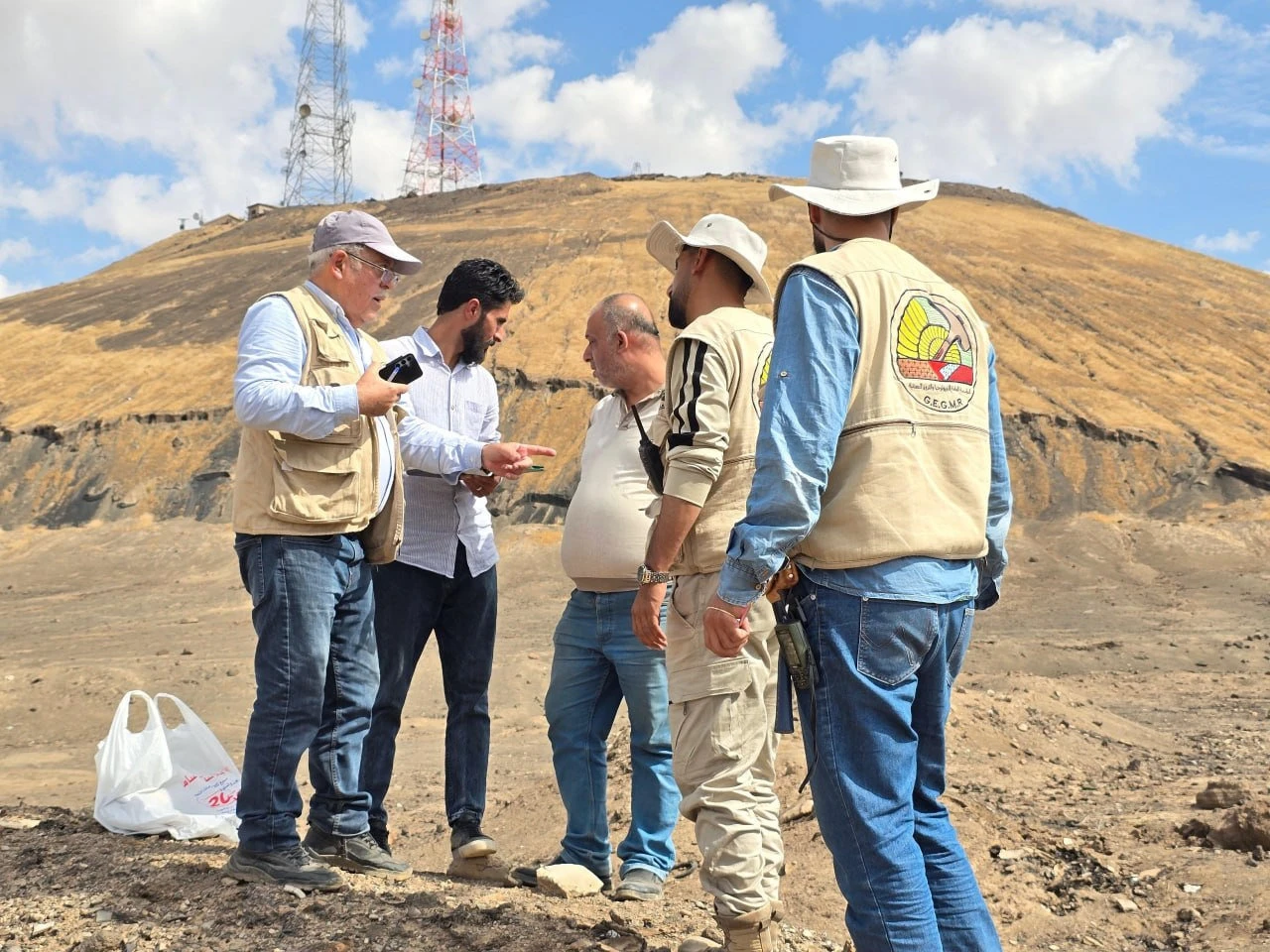 Members of a Syrian technical committee monitor unusual vapors at Jabal Kawkab east of Hasakah, October 2026. (Ministry of Emergency and Disaster Management handout photo / Via SANA)