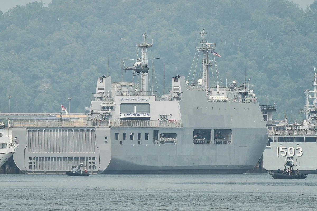 A Malaysian Navy helicopter patrols an area near ships waiting to transport dozens of Myanmar nationals at Lumut, on the outskirts of Kuala Lumpur on September 29, 2026. (AFP)