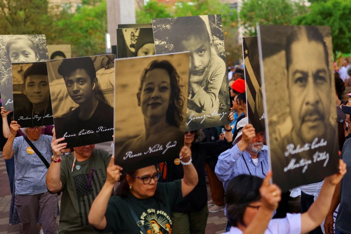 Members of the Catholic Church hold placards with photographs and names of people who died in immigration-related circumstances as they take part in a protest against mass deportations and the immigration policies of US President Donald Trump in El Paso, Texas, on March 24, 2026. (REUTERS/File Photo)