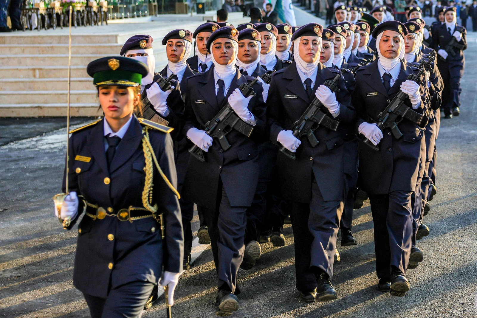 New female cadets from the new women's police academy perform stunts during the first cohort graduation ceremony after completing a six-month training program, in al-Tall on the northern outskirts of Damascus. (AFP)