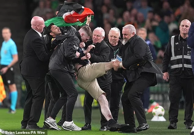 A man had tried running onto the field before being stopped by stewards. Irish broadcaster RTÉ reported he was carrying a Palestinian flag. (X/@DailyMail)
