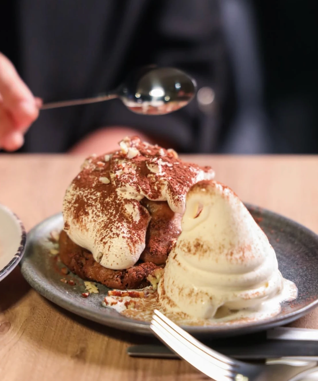 Dessert options include Nutella cookies served with vanilla ice cream and salted pretzel, as well as chocolate cookies topped with espresso cream foam. (Supplied)