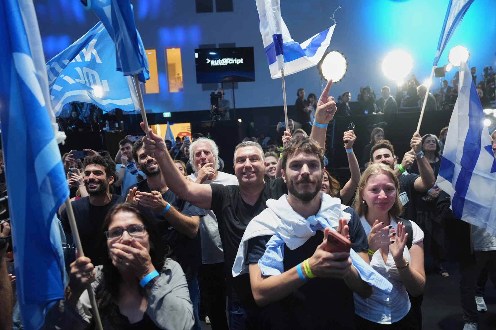Supporters of Gadi Eisenkot, leader of the Yashar ("Straight") party, react after the release of the first exit poll results in Israel's general election in Tel Aviv, Tuesday, Oct. 27, 2026. (AP) (AP Photo/Ariel Schalit)