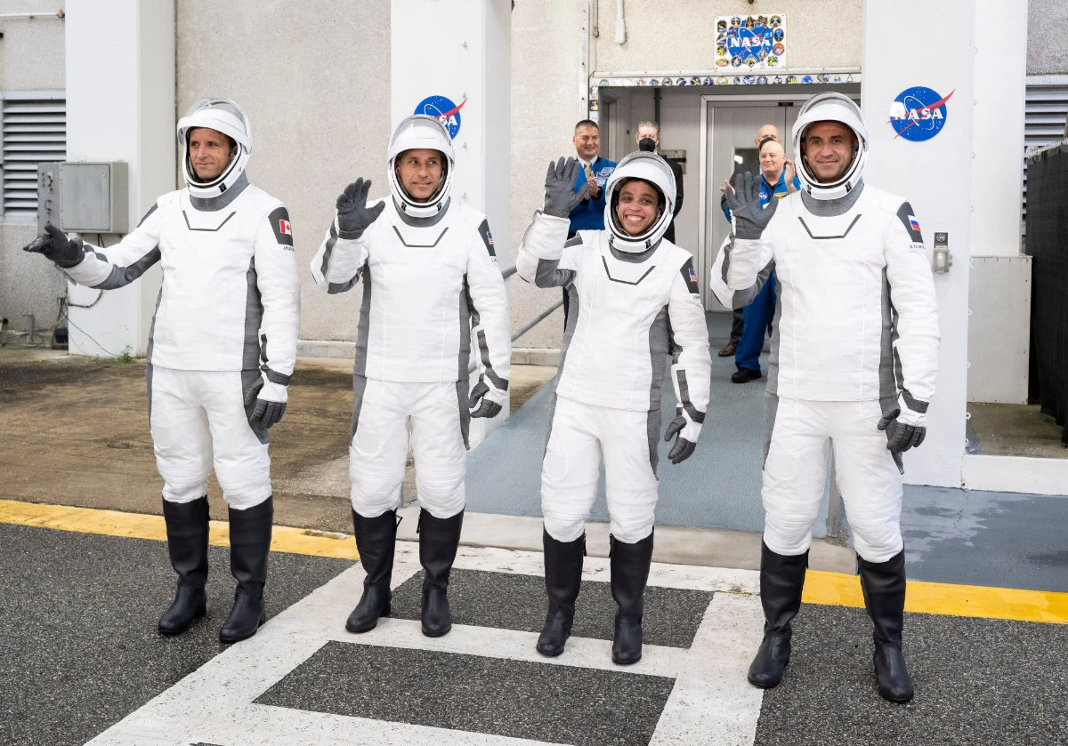 Canadian Space Agency astronaut Joshua Kutryk, left, NASA astronauts Luke Delaney and Jessica Watkins, and Roscosmos cosmonaut Sergey Teteryatnikov, wearing SpaceX spacesuits, prepare to board the SpaceX Dragon spacecraft for the Crew-13 mission launch on Oct. 1, 2026, at NASA's Kennedy Space Center in Florida. (NASA via AP)