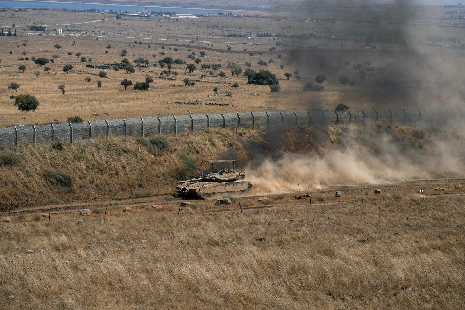 An Israeli tank drives along the ceasefire line between the Israeli-occupied Golan Heights and Syria, on its Israeli side August 20, 2026. (Reuters)