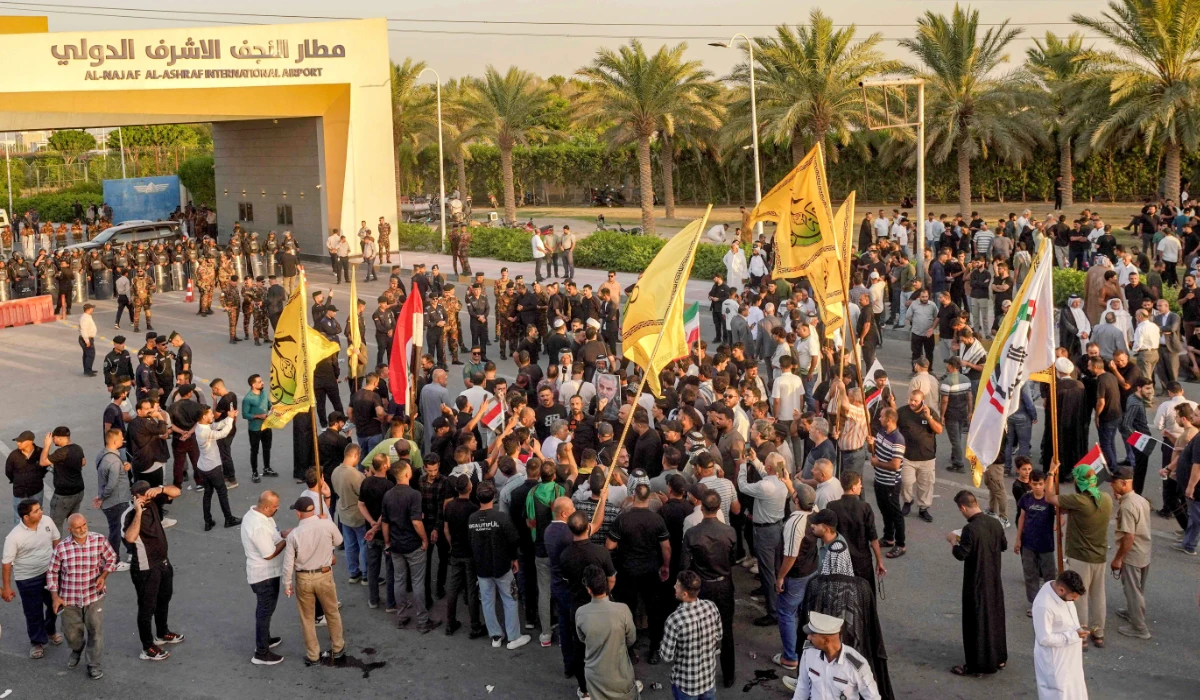 Demonstrators gather outside the Al-Najaf Al-Ashraf International Airport in Najaf on September 28, 2026, demanding the facility to be reopened for flights from Iran. (AFP)