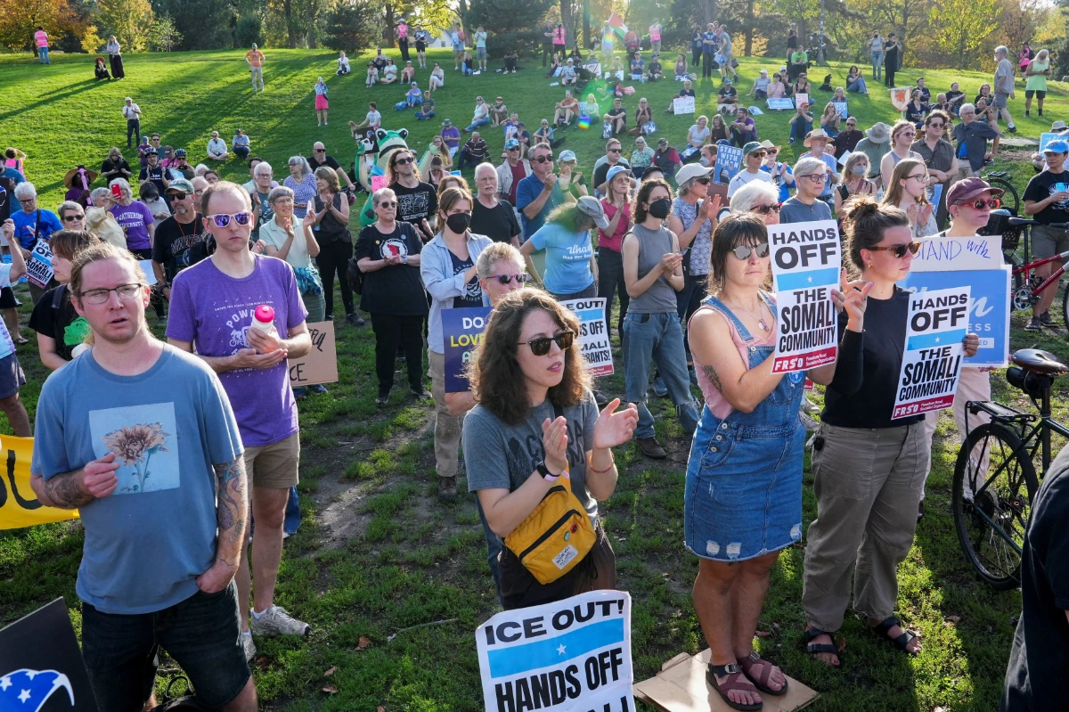 Supporters of Democratic US Representative Ilhan Omar attend a rally in Minneapolis, Minnesota, on October 12, 2026, after federal authorities conducted a predawn raid on her Washington, DC-area home. (REUTERS)