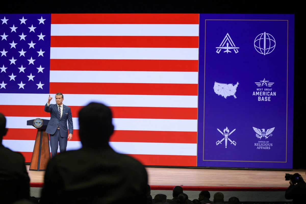 Secretary of Defense Pete Hegseth gestures after giving a State of the Force address at Marine Corps Base Quantico on Sept. 30, 2026 in Quantico, Virginia. (Pool Photo via AP)
