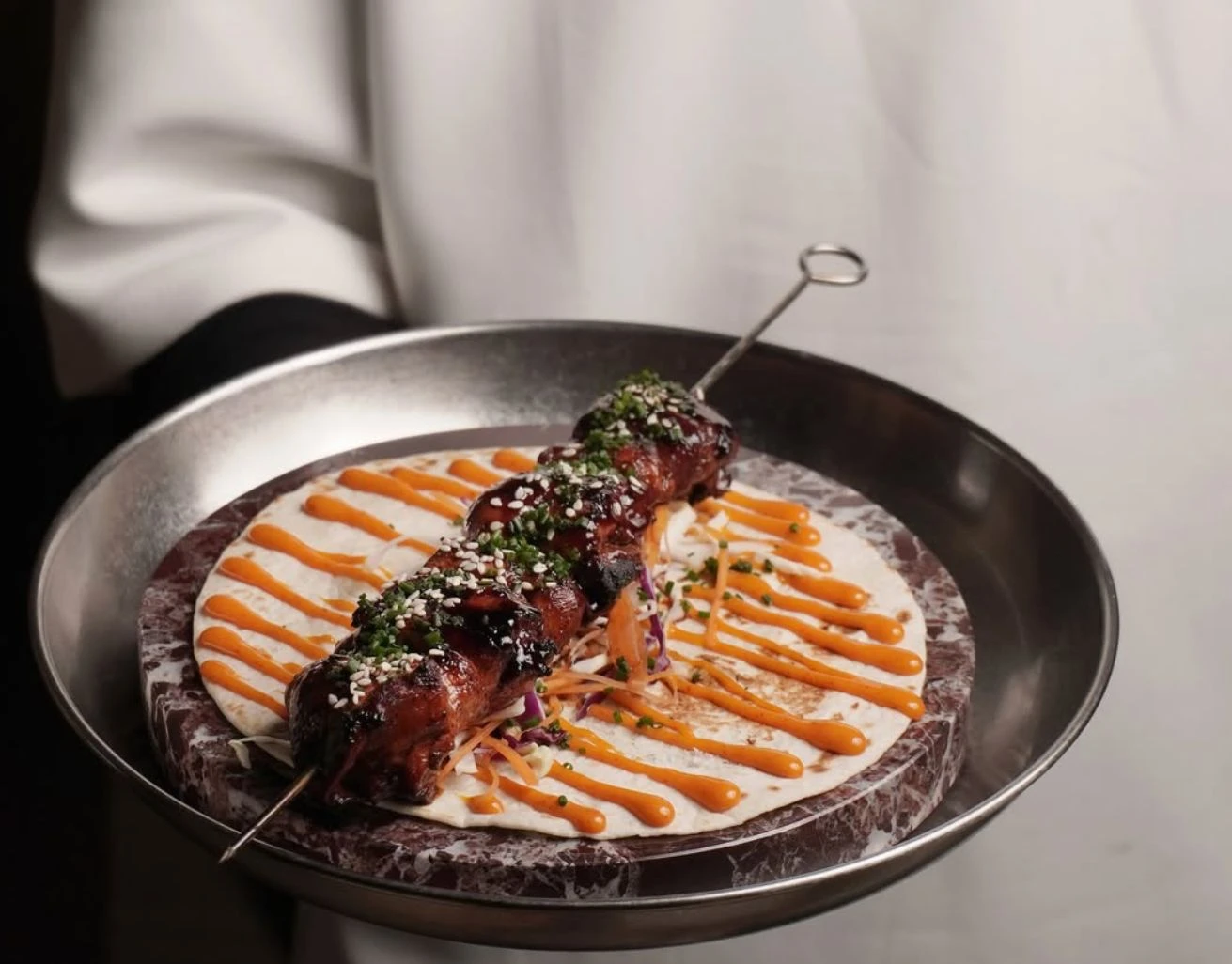 The restaurant’s wood-fire technique brings depth to dishes without overwhelming their distinct flavors. (Supplied)