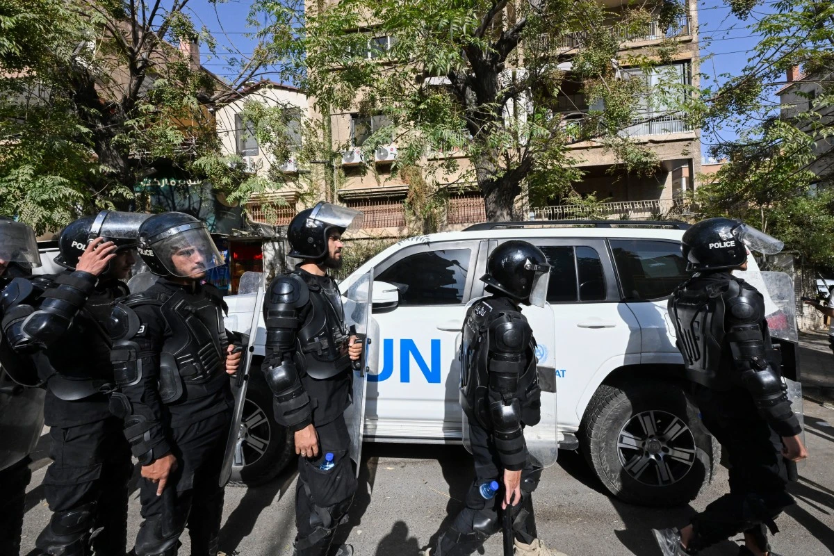 Syrian security forces take positions during a protest against Israeli military incursions in southern Syria, near the United Nations building in Damascus, on October 23, 2026. (AFP)