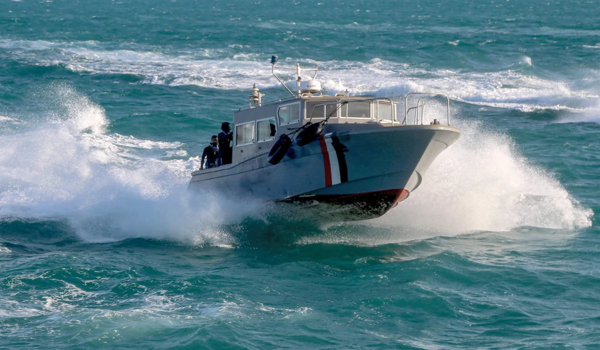 Yemeni coastguard members loyal to the internationally-recognised government ride in a speedboat cruising in the Red Sea off of the government-held town of Mokha in the western Taiz province, close to the strategic Bab Al-Mandab Strait, on December 12, 2023. (AFP)