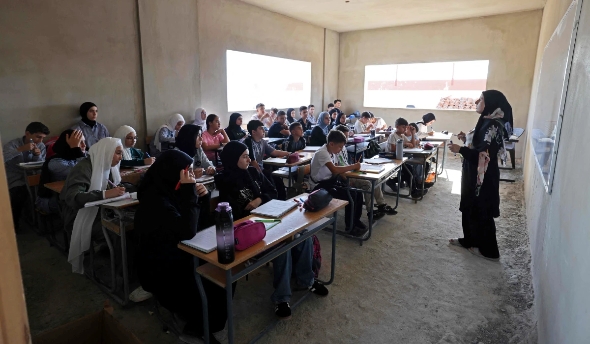 Students attend their class in a newly built but unfinished section of Burj Qalaway Intermediate School, whose campus was earlier damaged by Israeli strikes, during the first day of school year at Burj Qalaway in southern Lebanon on September 24, 2026. (AFP)