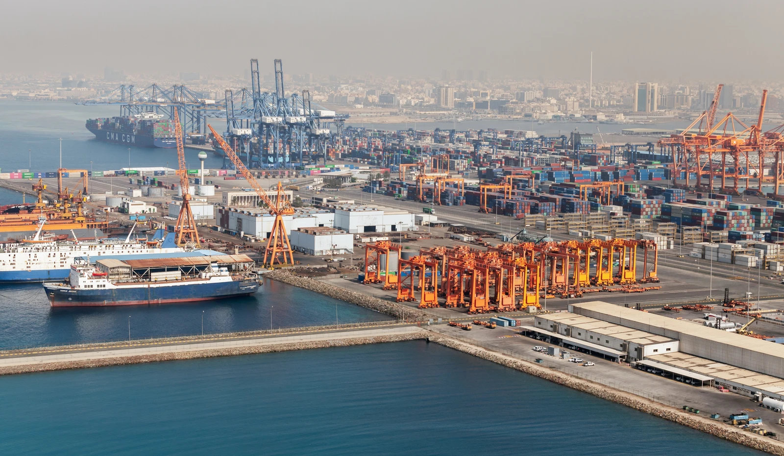 Jeddah, Saudi Arabia - December 22, 2019: Jeddah Islamic Seaport aerial view, cargo ships and cranes