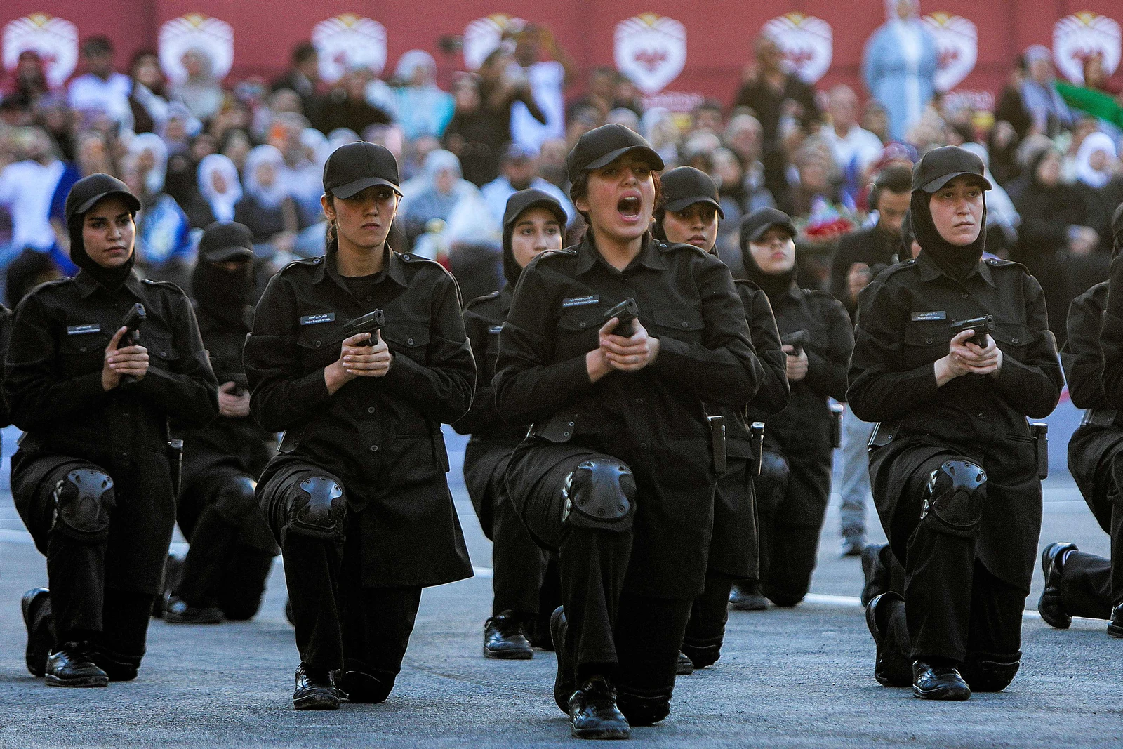 New female cadets from the new women's police academy perform stunts during the first cohort graduation ceremony after completing a six-month training program, in al-Tall on the northern outskirts of Damascus. (AFP)