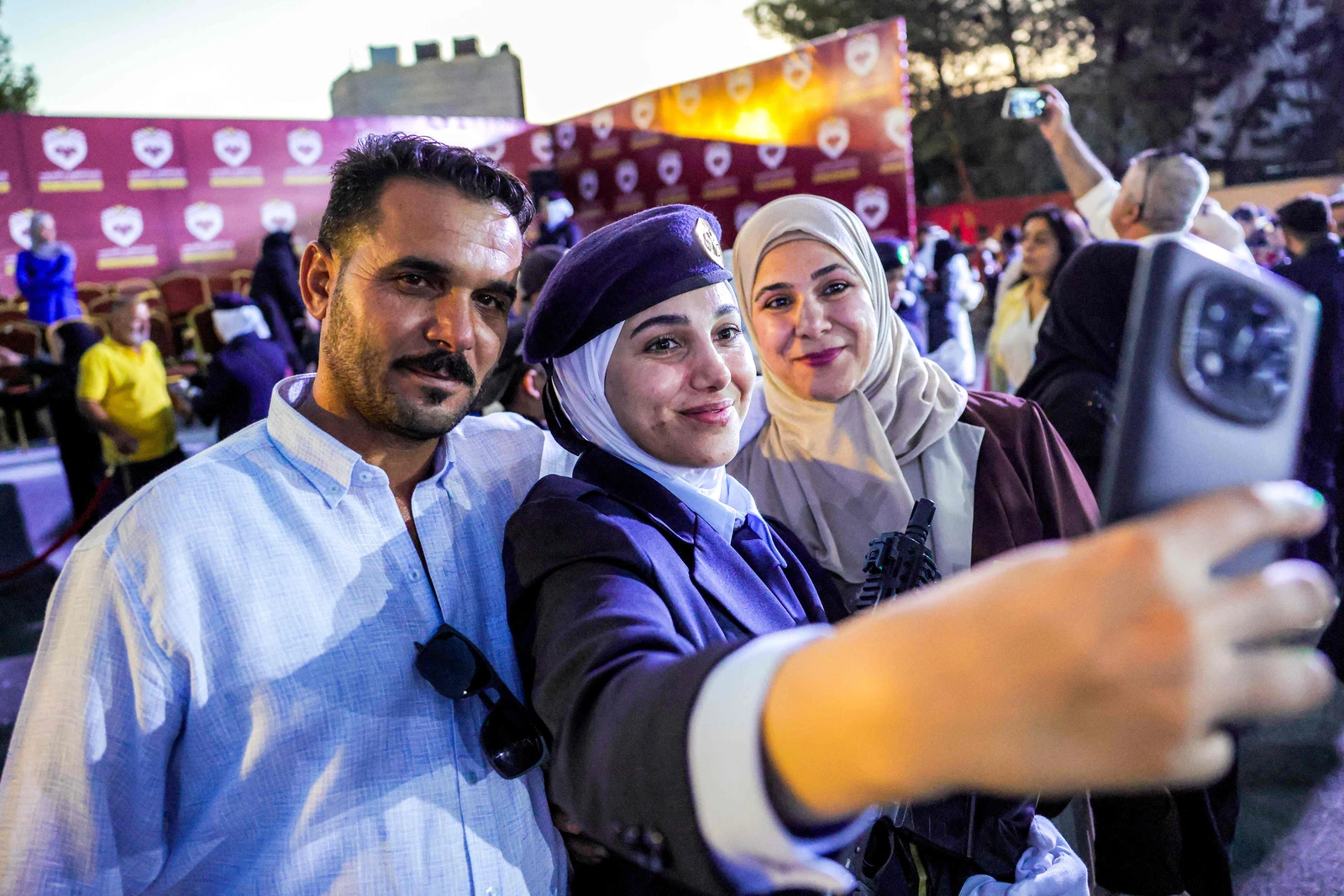 A new female cadet from the new women's police academy poses for a picture during the first cohort graduation ceremony in al-Tal on the northern outskirts of Damascus. (AFP)