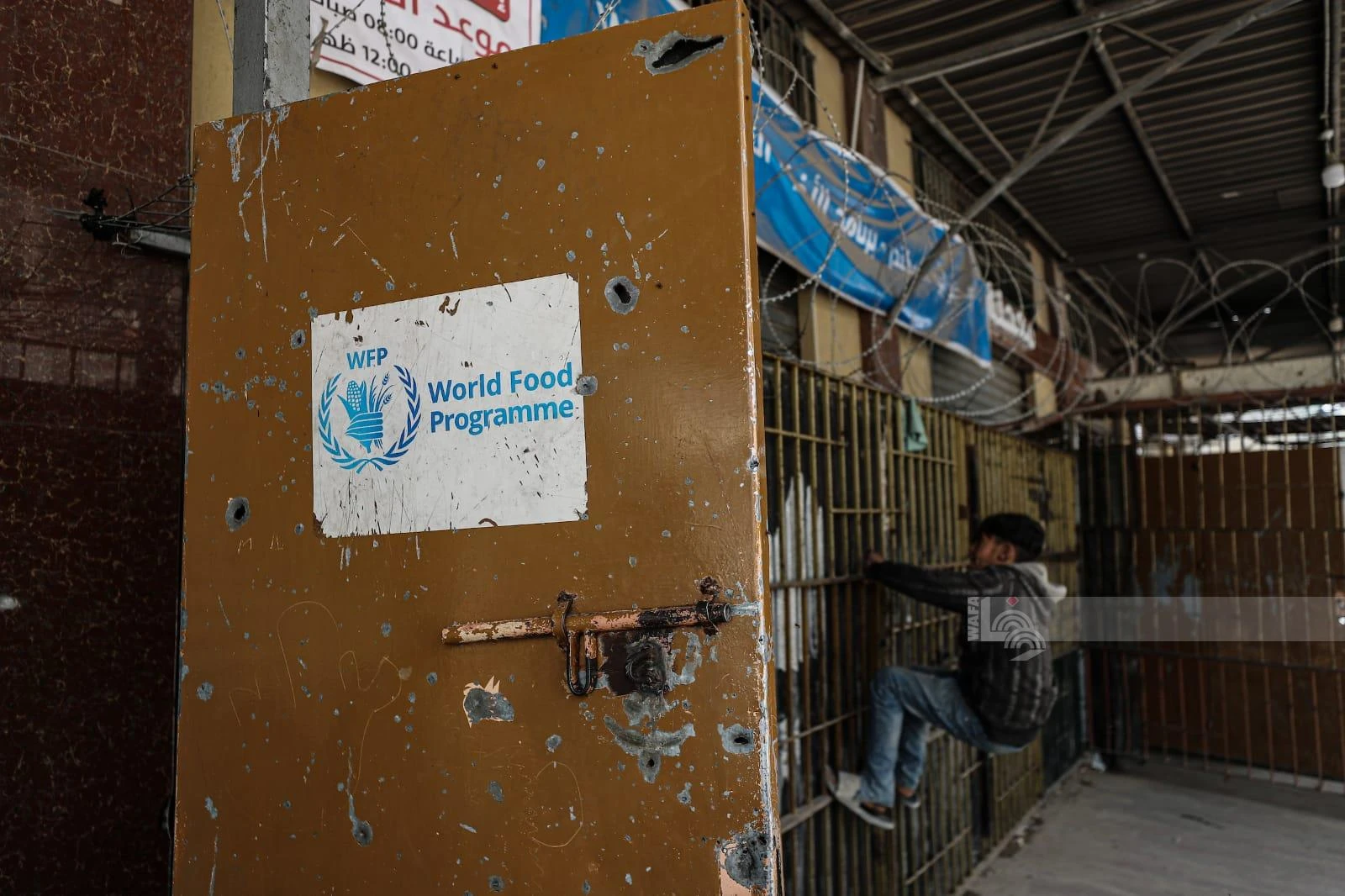 The World Food Program has cut the number of people receiving assistance from 1.8 million to about 500,000 because of funding shortages. (WAFA)