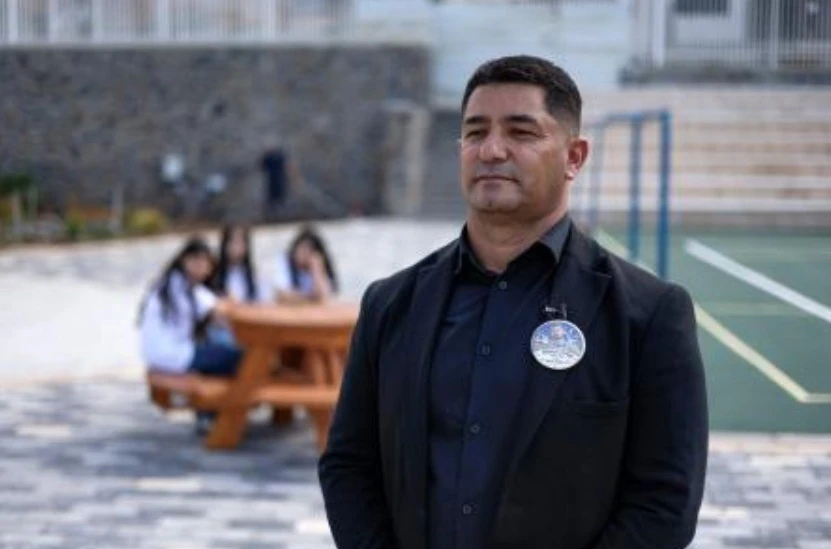Wael Mughrabi, local head of the municipality, poses for a picture during an interview with AFP at the new school in the Druze village of Ein Qiniyye in the Israeli-annexed Golan Heights on Oct. 4, 2026. (AFP)