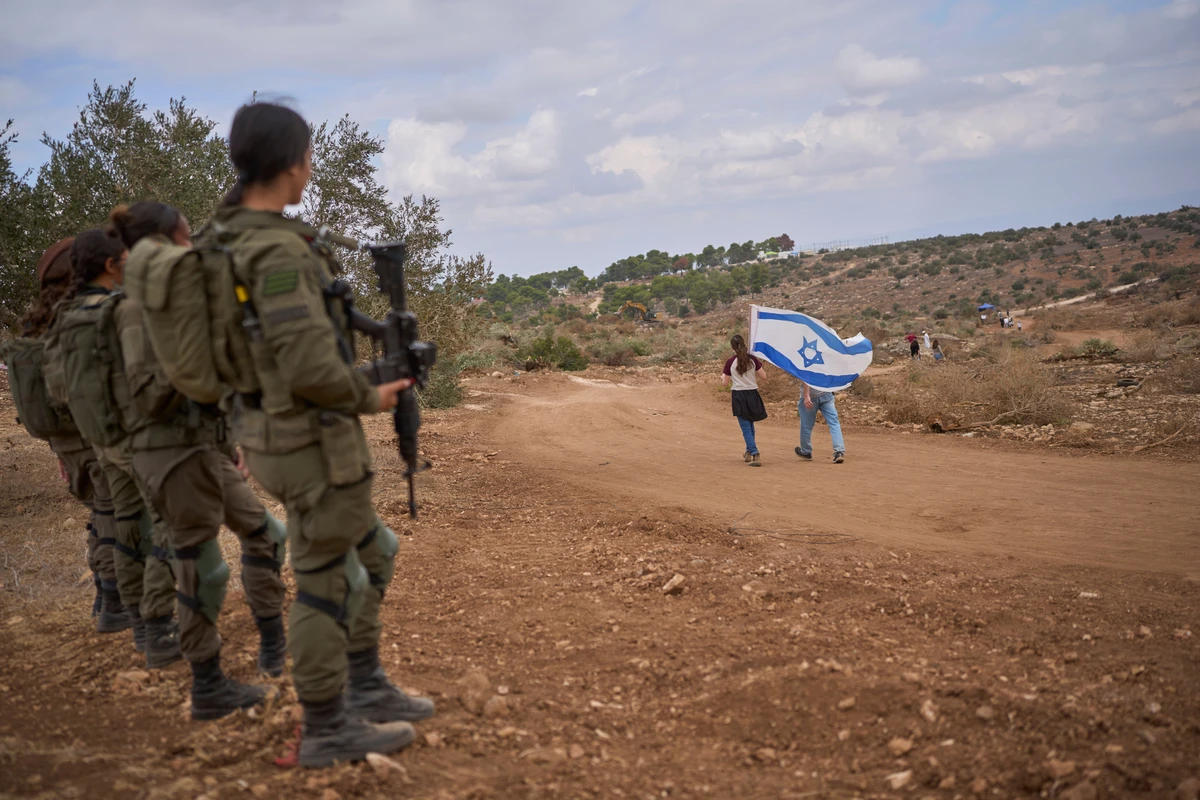 More than 500,000 Israelis live in the West Bank in settlements illegal under international law, a minority of whom engage in violence towards Palestinians. (File/AP)