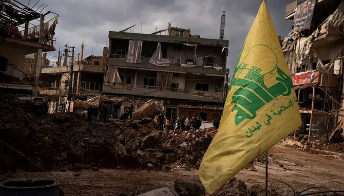 A Hezbollah flag is seen in front of destroyed buildings after an airstrike in Nabi Chit, Lebanon, Mar. 7, 2026. (Getty Images)