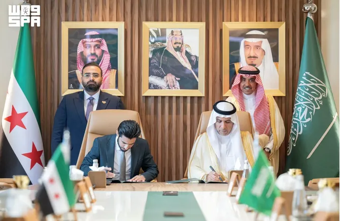 Accord is signed by Ali bin Abdullah Al-Zaid (R), chief executive of Saudi Arabia’s Broadcasting and Television Authority, and Alaa Mustafa Bursailo, director-general of Syria’s General Organization of Radio and Television. (SPA)