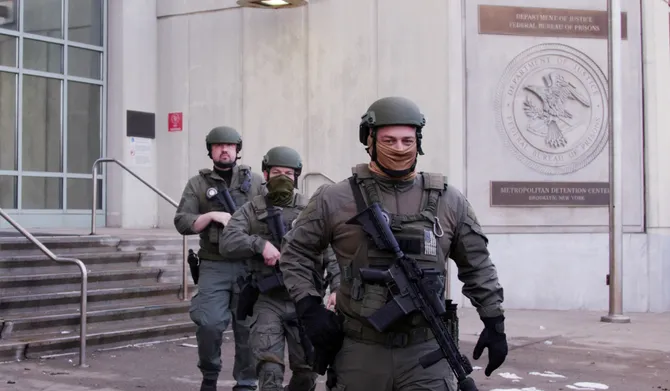 US Department of Justice federal officers stand guard outside the Metropolitan Detention Center in the Brooklyn borough of New York City, on January 4, 2026. (AFP)
