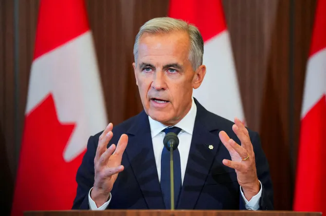 Canada’s Prime Minister Mark Carney speaks with the news media after he suspended trade negotiations with the United States, in Ottawa, Ontario, Canada August 22, 2026. REUTERS/Chris Tanouye