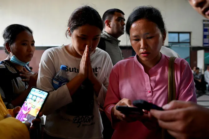 Family members check a list of people who were injured following a deadly flash flood, outside a trauma centre of Bir Hospital in Kathmandu, Nepal, August 26, 2026. (REUTERS)
