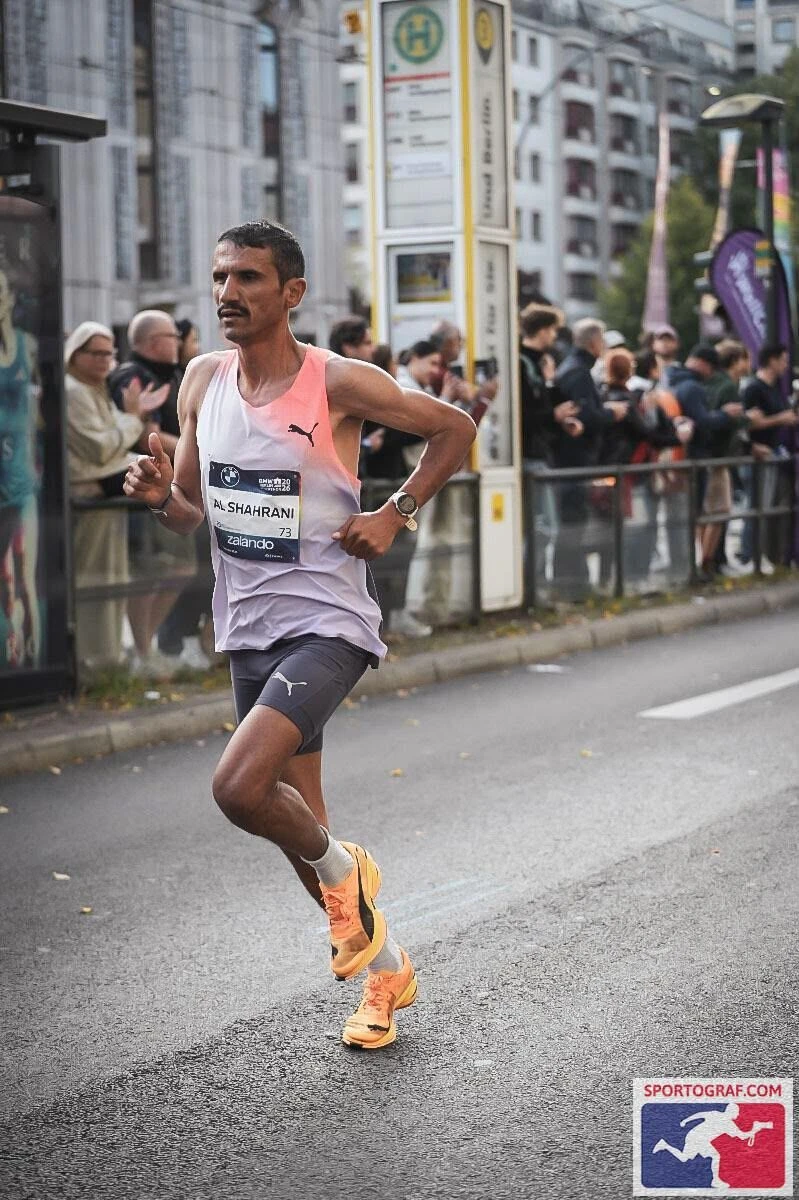 Al-Shahrani passes spectators lining the course in Berlin.