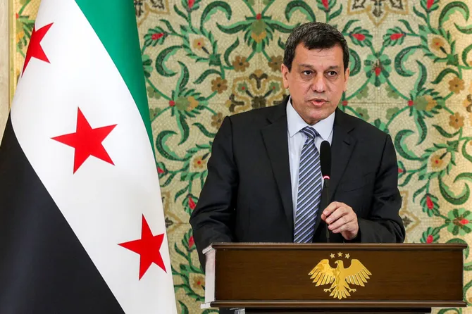 Head of Kurdish forces in Syria announces their dissolution after merging with army