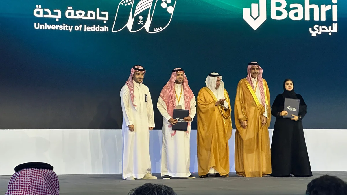 Representatives of Bahri and the University of Jeddah sign a partnership agreement during the Saudi Maritime and Logistics Congress at the Jeddah Superdome. (AN photo/ Nada Hameed)