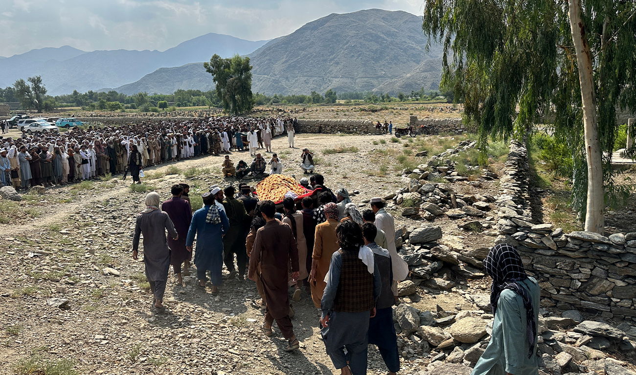 Afghans carry the body of a victim, who was killed in a Pakistani airstrike, during a funeral ceremony in the Nurgal district of Afghanistan's Kunar province on September 21, 2026. (AFP)
