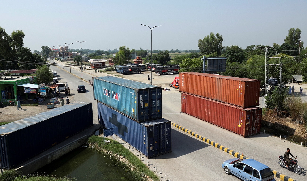 Shipping containers used to block the area, ahead of a planned march by former Pakistani Prime Minister Imran Khan's party Pakistan Tehreek-e-Insaf (PTI), in Islamabad, Pakistan, September 30, 2026. (Reuters)