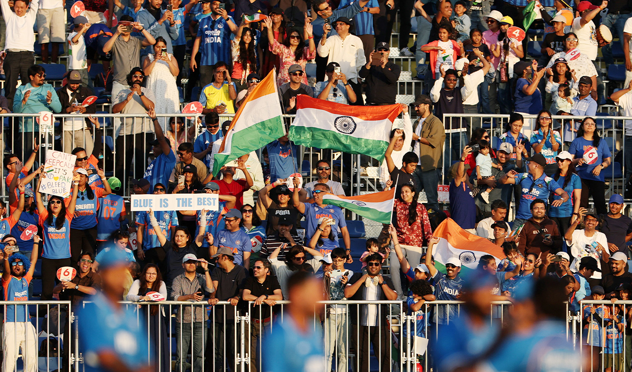 India fans celebrate in the stands after India won the men’s cricket gold medal match against Pakistan at the Asian Games in Nisshin, Japan, on October 3, 2026. (Reuters)