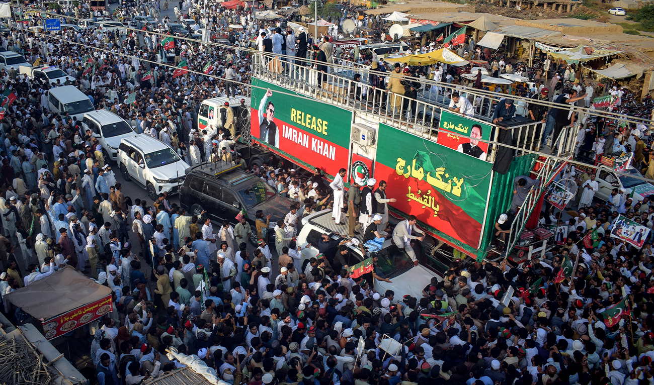 Supporters of jailed former prime minister Imran Khan's Pakistan Tehreek-e-Insaf (PTI) party take part in a long march in Lakki Marwat of Pakistan's Khyber Pakhtunkhwa province on October 4, 2026. (AFP)
