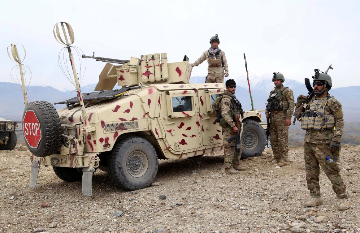 Afghan security officials patrol as the security forces are engaged in an operation against the Daesh militants, in Khogiani district of Nangarhar province, Afghanistan. (EPA)