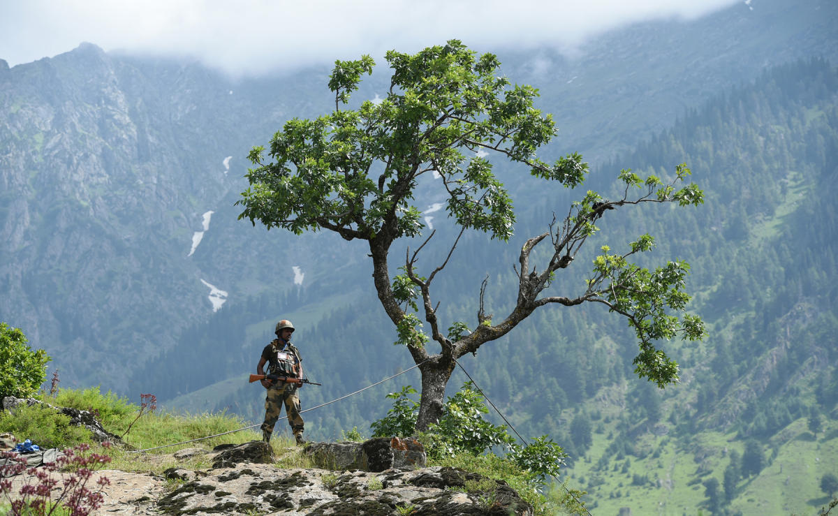 In this file photo, an Indian Border Security Force (BSF) soldier stands guard on top of a hill in Chandanwari in Anantnag district, some 115 km southeast of Srinagar on July 11, 2017. (AFP)
