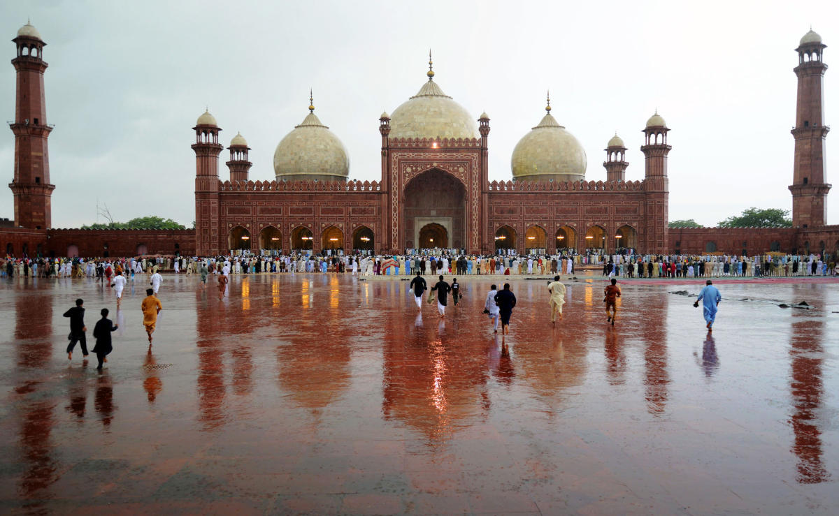 In this file photo, Pakistani Muslim devotees arrive to offer Eid prayers on the first day of the Eid al-Fitr festival at Badshahi Masjid in Lahore on July 29, 2014. (AFP)