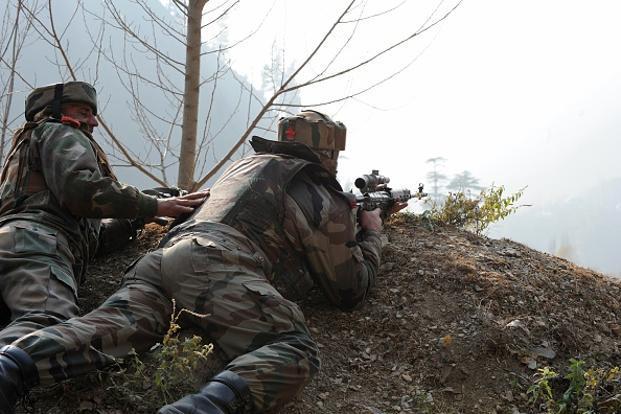 Indian soldiers get in position overlooking army barracks. (AFP)