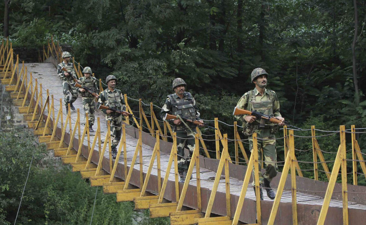 In this file photo, Indian Border Security Force (BSF) soldiers patrol over a footbridge built over a stream near the Line of Control (LoC), a ceasefire line dividing Kashmir between India and Pakistan, at Sabjiyan sector of Poonch district, Aug. 8, 2013. (REUTERS)