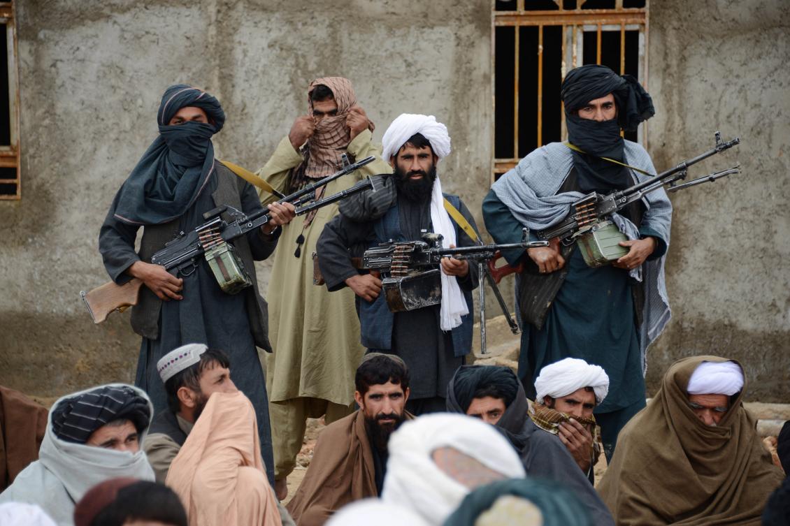 Afghan Taliban fighters listen to Mullah Mohammed Rasool, who was elected leader of a breakaway faction of the Taliban, in Farah province, Afghanistan in November, 2017. (AP, File)