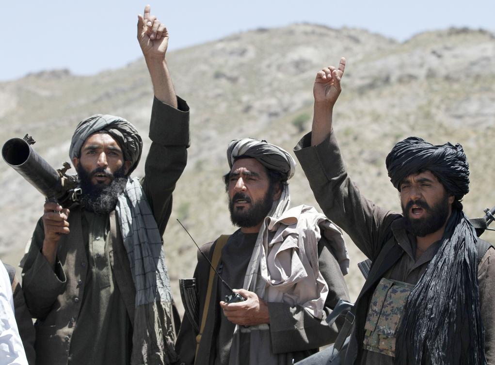 In this file photo, Taliban fighters react to a speech by their senior leader in the Shindand district of Herat province, Afghanistan. (AP)