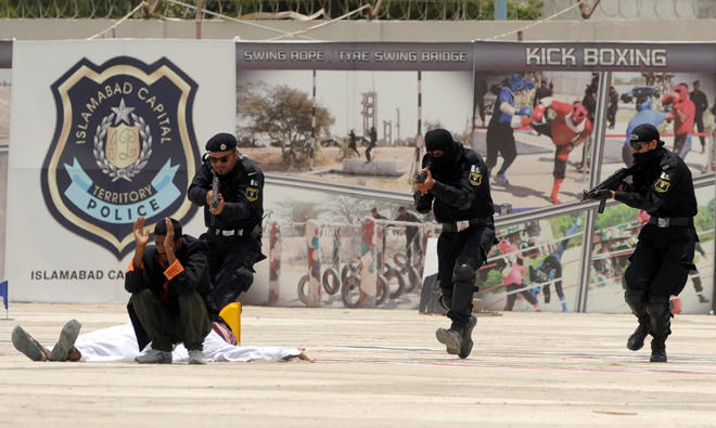 In this file photo, Pakistani police commandos take part in anti-terrorism training during the passing-out ceremony of the Special Security Unit (SSU) in Karachi. (AFP)