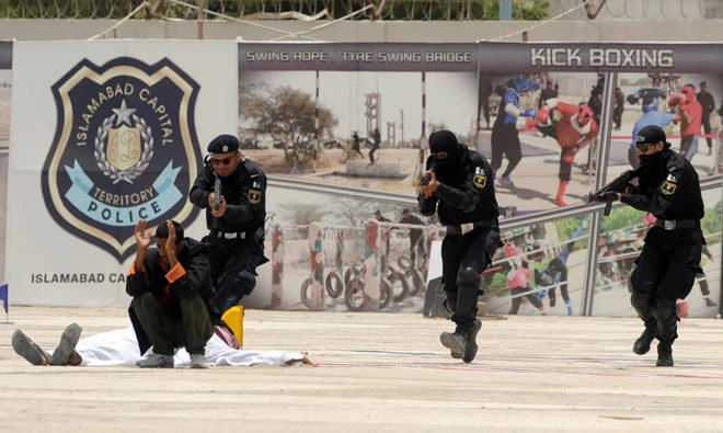 In this file photo, Pakistani police commandos take part in anti-terrorism training during the passing-out ceremony of the Special Security Unit (SSU) in Karachi. (AFP)