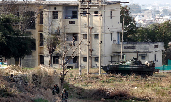 In this file photo, Indian Army soldiers take positions outside the residential quarters on the second day of a militant attack at Sunjwan Army camp in Jammu. (AFP)