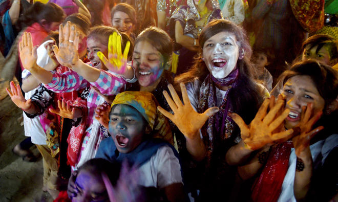 Pakistani Hindu children celebrate holi in Karachi, on the occasion of Holi festival. (AFP)