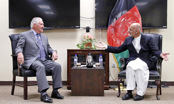 In this file photo, US secretary of state Rex Tillerson (L) speaks with Afghan President Ashraf Ghani before their meeting at Bagram Air Field in Afghanistan. (AFP)