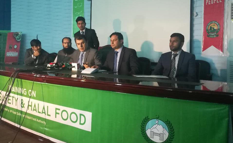 Director General of KP Food Safety and Halal Food Authority Riaz Mehsud, center, briefing media at the inaugural ceremony in Peshawar on Monday. (AN photo by Shahid Shalmani)