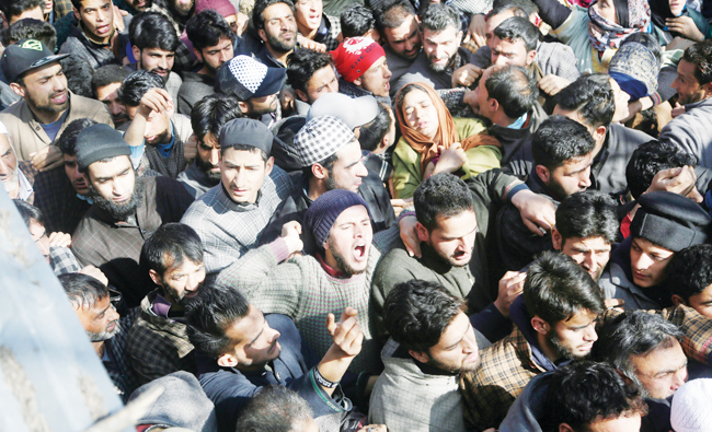 Kashmiri villagers shout slogans as they attend the funeral of civilian Suhail Ahmad at Pinjura village 52 kilometers south of Srinagar on Monday. (AP)